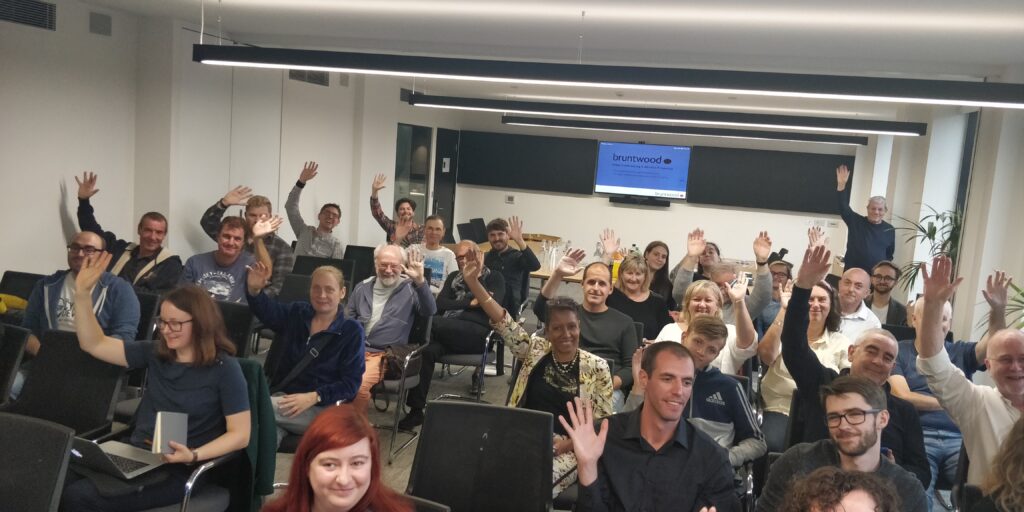 Attendees at WordPress Leeds waving